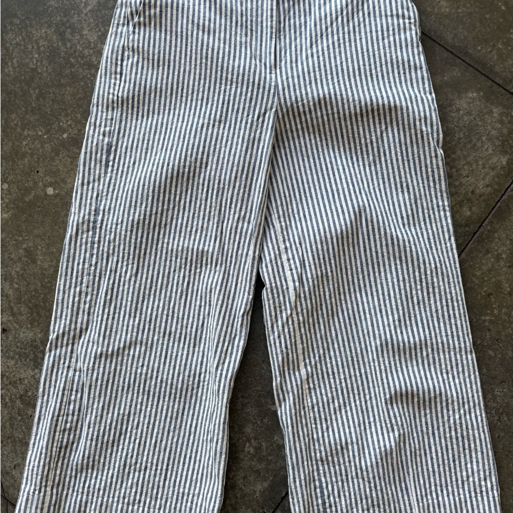 Women’s cropped blue and white striped linen pants.